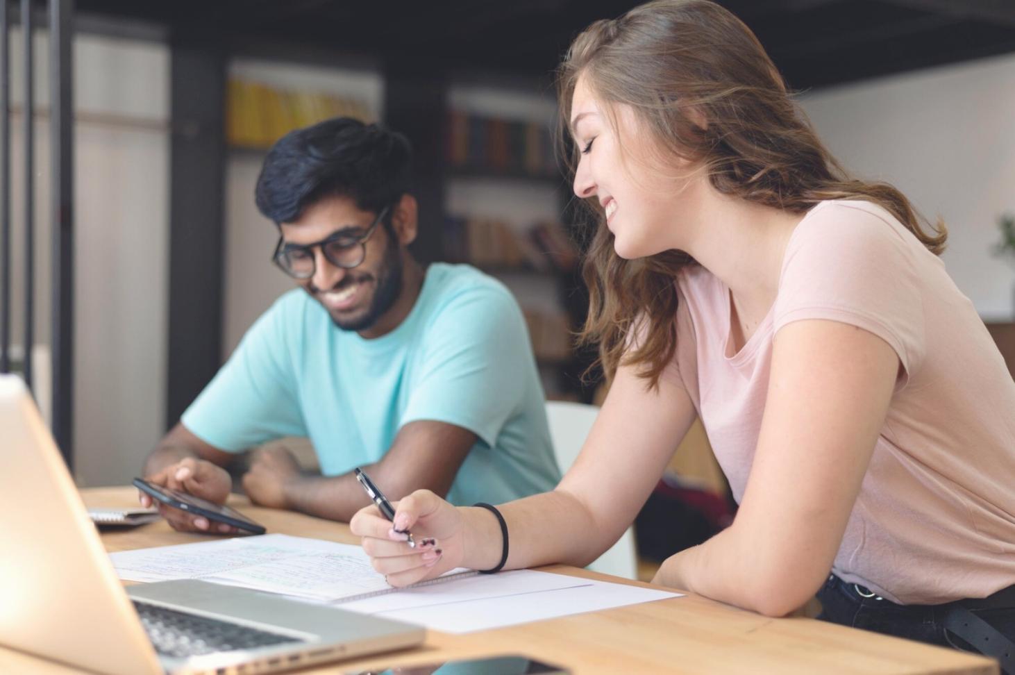 Financial planning materials and business documents spread across a desk during a strategic planning session